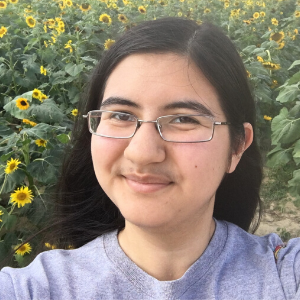 Jordan Graham standing in sunflower field