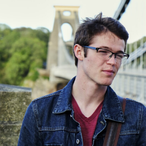 Chase Hockema standing on bridge