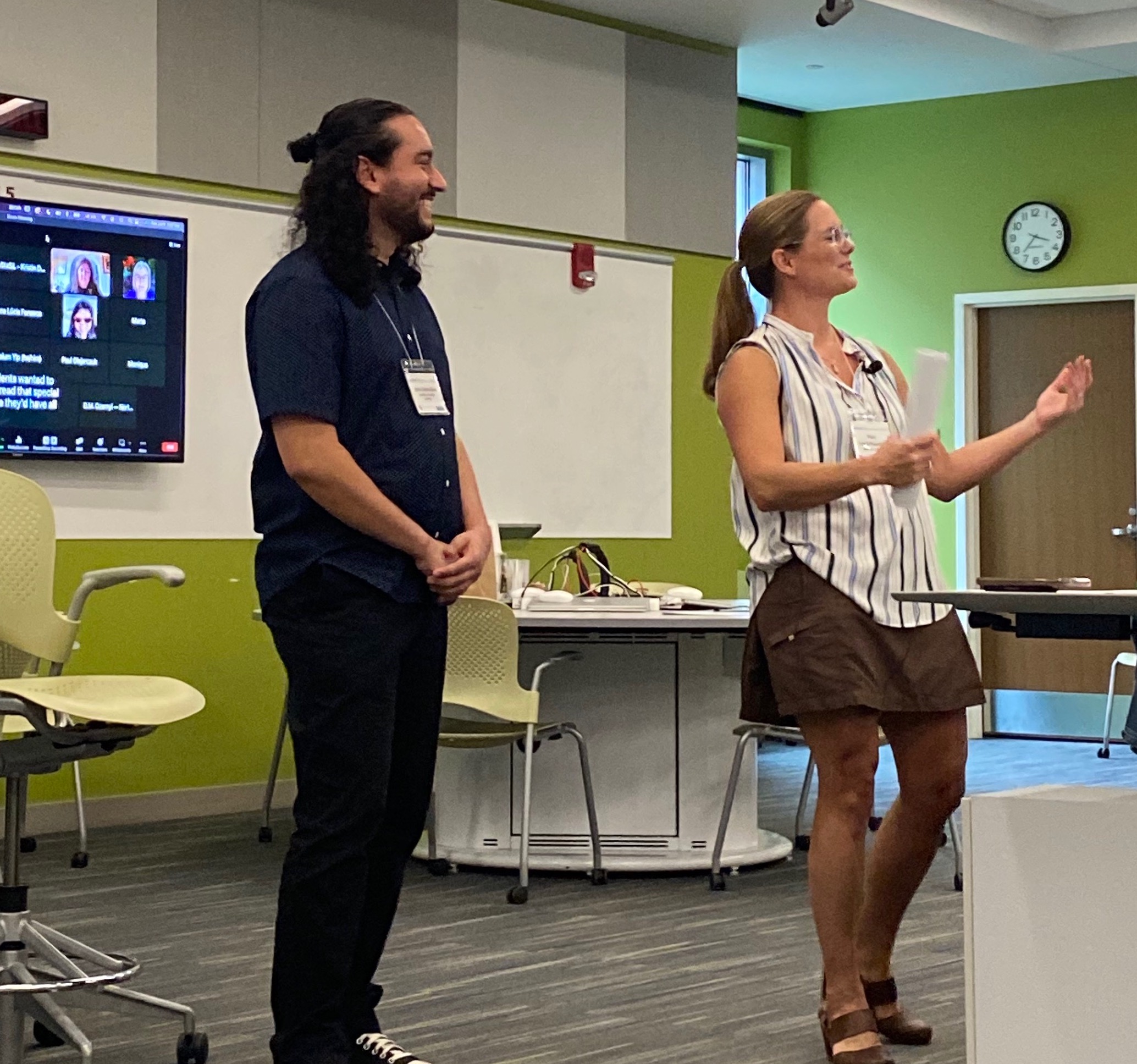 Dr. Vera Lee-Schoenfeld and Ph.D. candidate Jean Costa-Silva present before conference attendees.