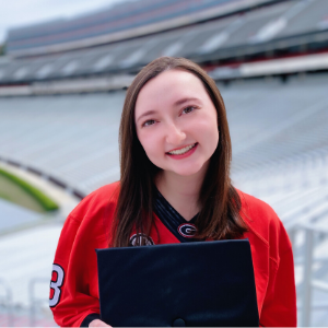 Scarlett McCullough wearing jersey in Sanford Stadium