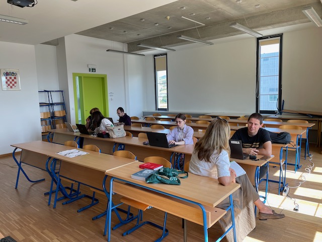 Researchers workshop together in a classroom.