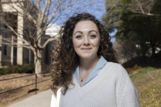 Image of Shannon Rodriquez in front of Gilbert Hall. Photo by Peter Frey