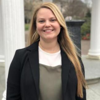 Graduate Student Meg Fletcher looks towards the camera