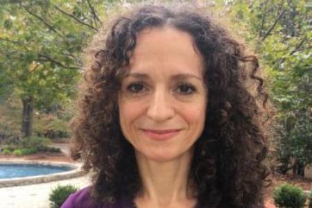 Photograph of Dr. Pilar Chamorro in front of fountain