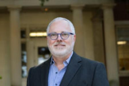 Headshot of Dr. Keith Langston in front of Joe Brown Hall