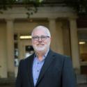 Headshot of Dr. Keith Langston in front of Joe Brown Hall